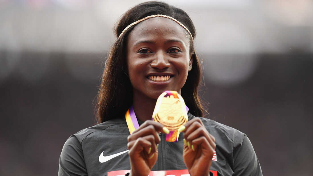 An image of Tori Bowie purposelyholding a gold medal. Bowie's death is a stark reminder of the alarming maternal mortality rate among Black women in the United States